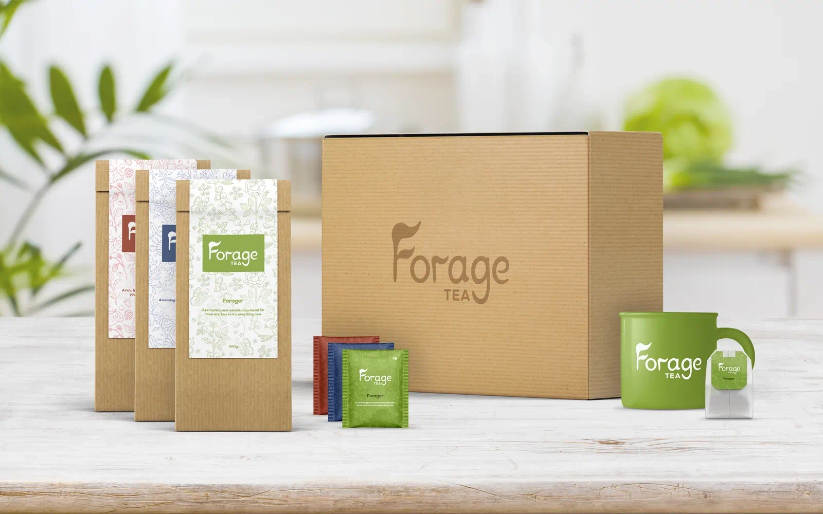 Packaging mockups with the Forage Tea branding, including various flavours in different colours, showing the outer box, inner packet, tea bag sachet and tea bag displayed in a well lit, white, modern kitchen