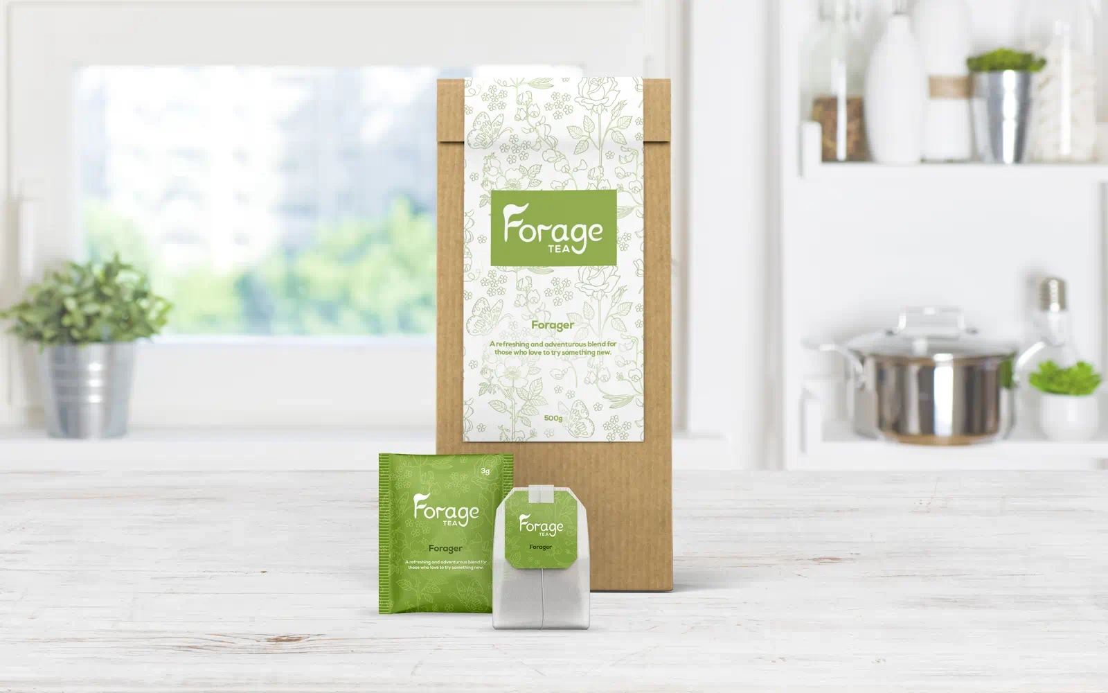 Packaging mockups with the Forage Tea branding, including the inner packet, tea bag sachet and tea bag displayed in a well lit, white, modern kitchen