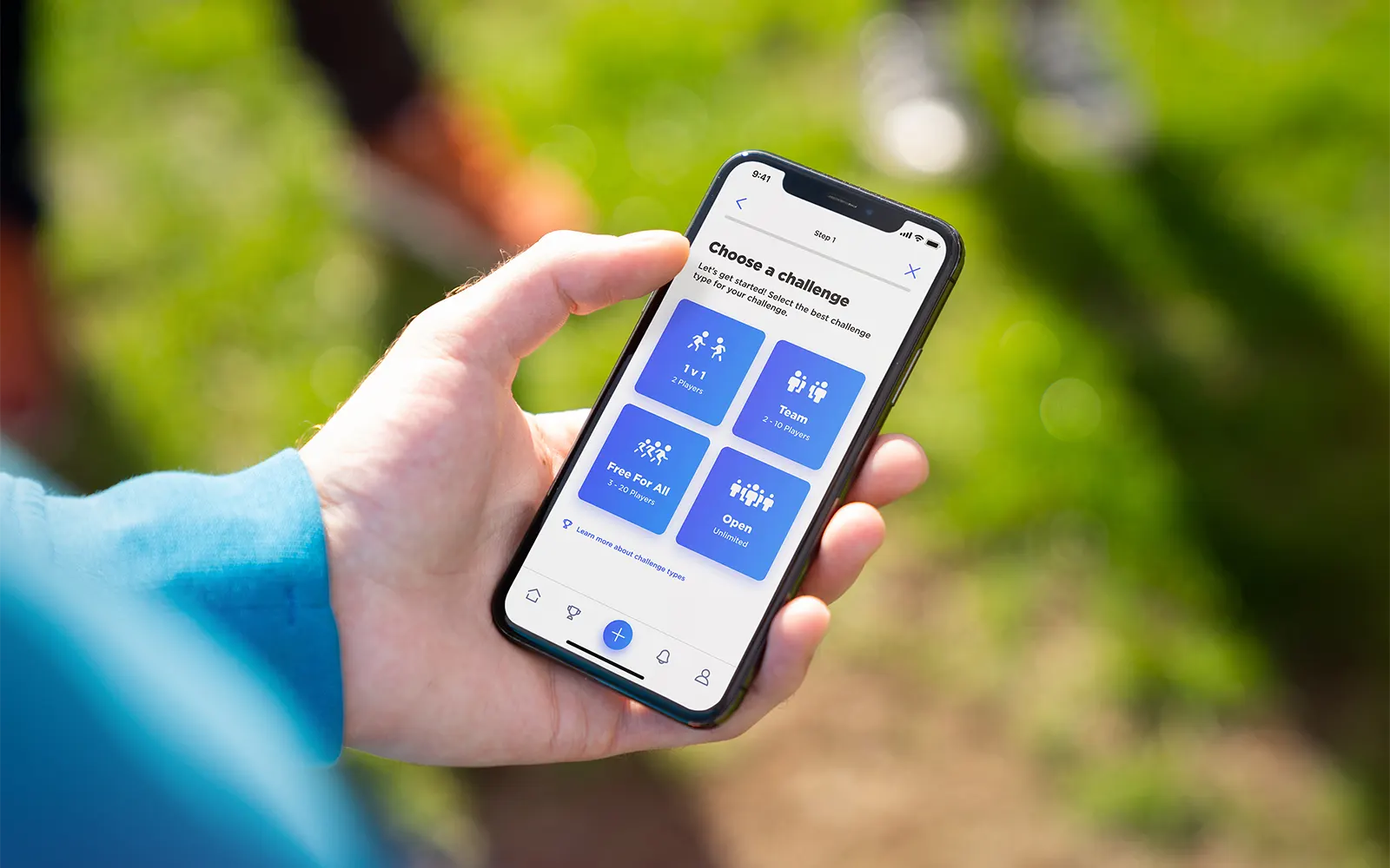 A close up of a smart phone showing the create challenge page from the Challenge Social app