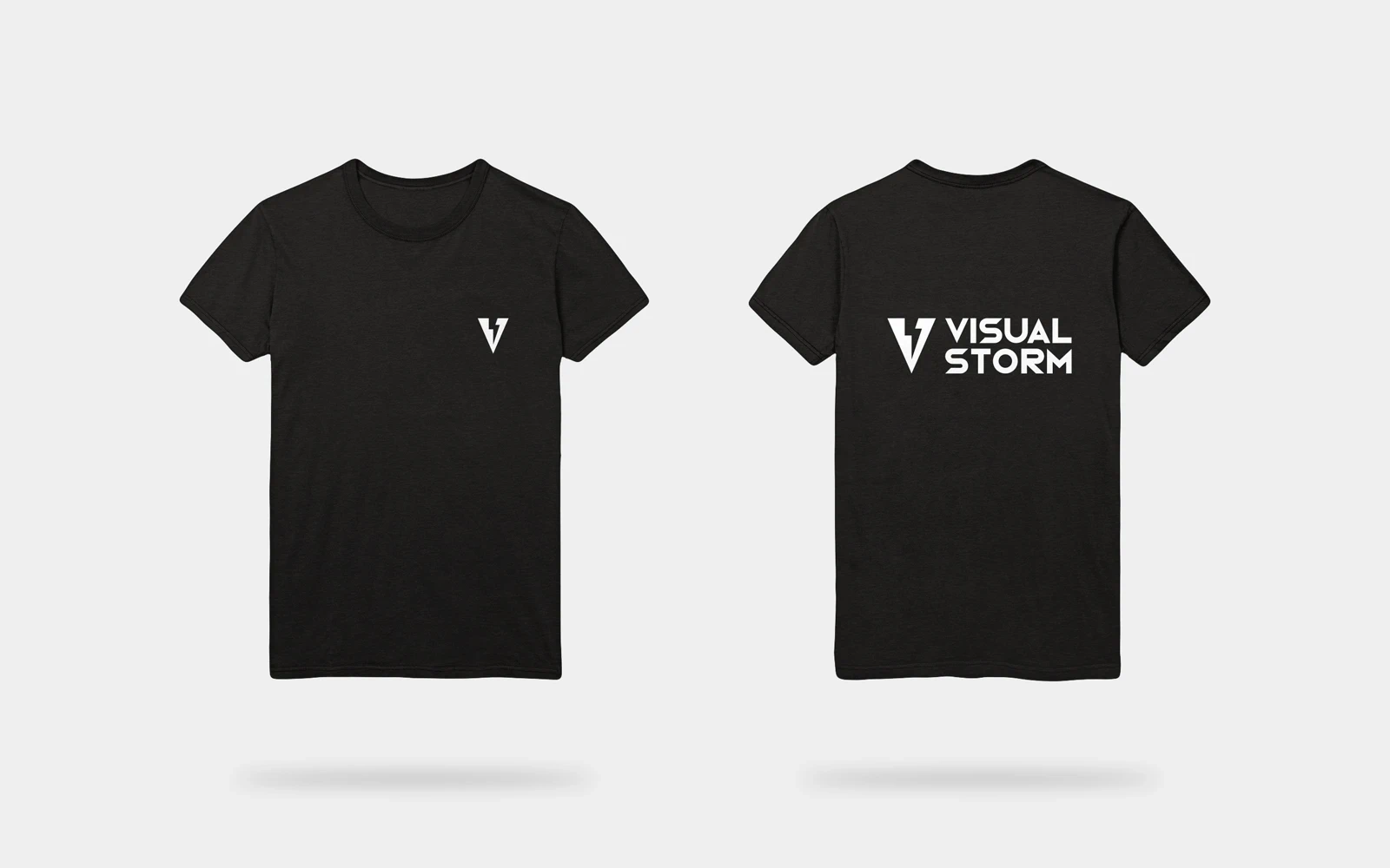 The front and back of the Visual Storm branded t-shirts are displayed on a plain, grey background. The t-shirt is black with the front showing the small version of the Visual Storm logo in the top right and the back featuring the large version of the logo positioned in the top centre