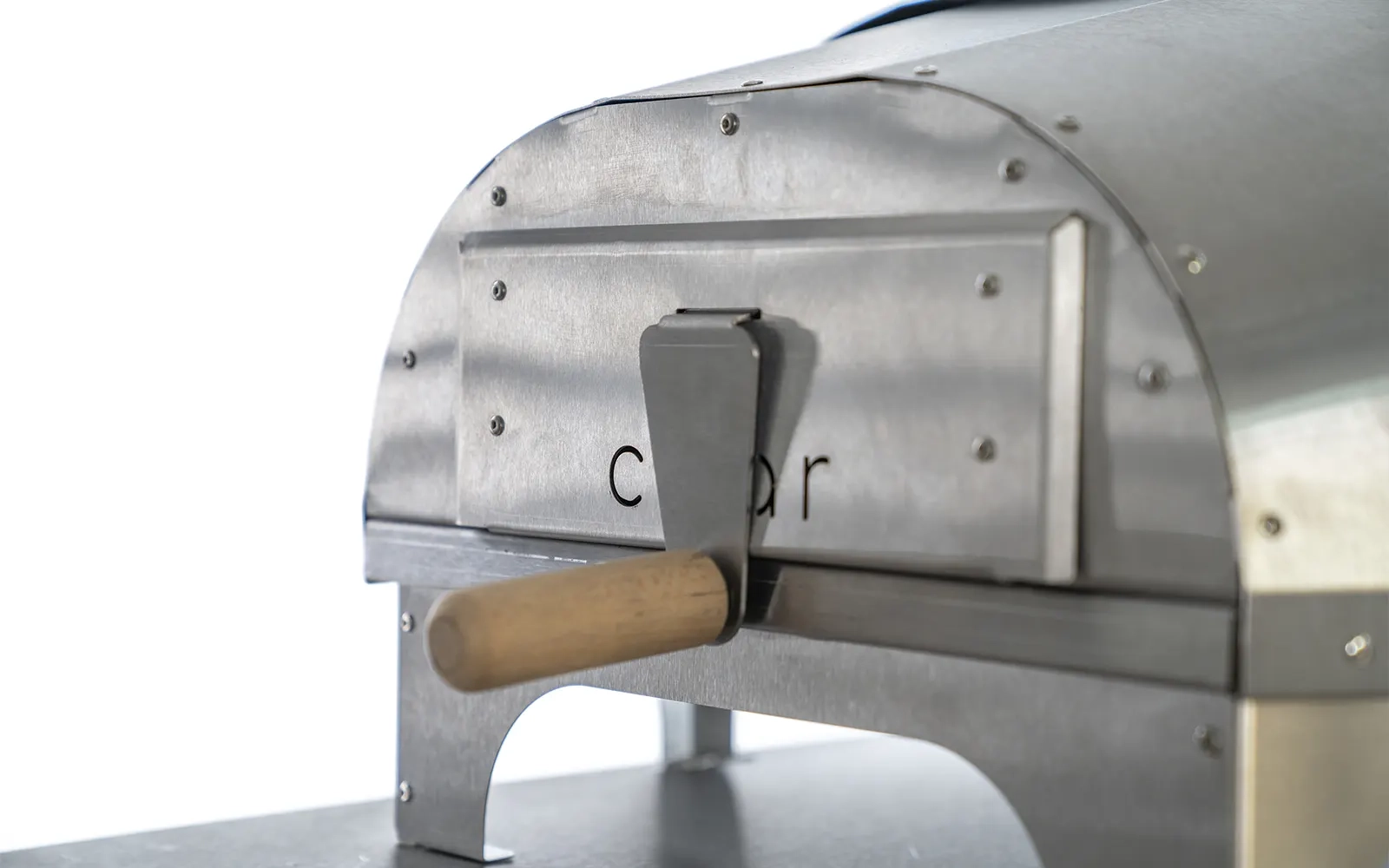 Close-up of the rear of The No.16 pizza oven with the hopper closed against a white background