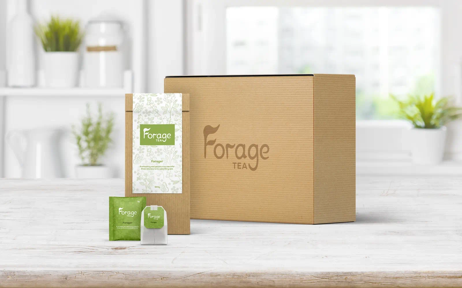 Packaging mockups with the Forage Tea branding including the outer box, inner packet, tea bag sachet and tea bag displayed in a well lit, white, modern kitchen